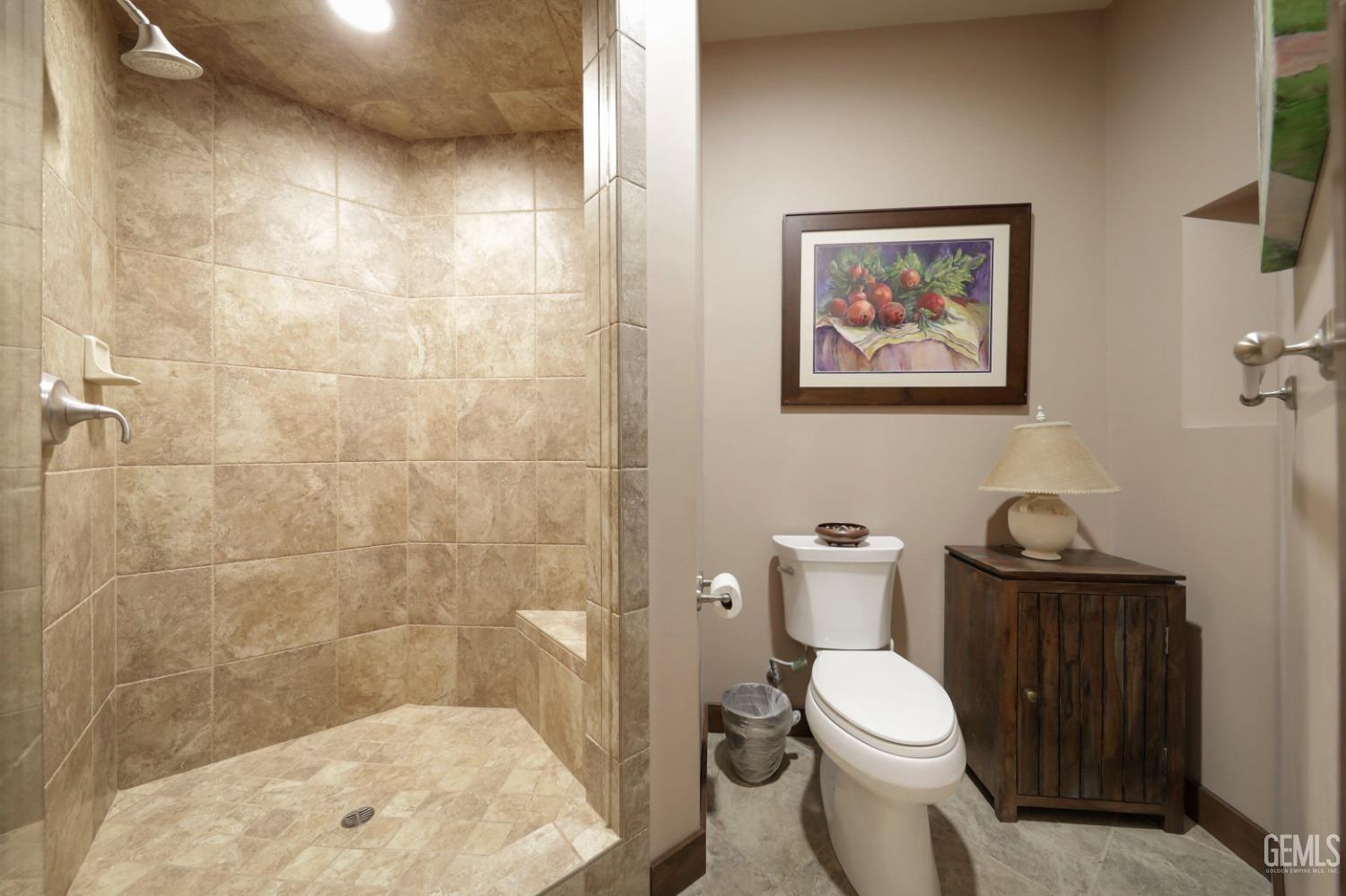 Undisclosed Address Bakersfield, CA 93308 - Photo 25 of 51 a white toilet sitting next to a bathroom sink