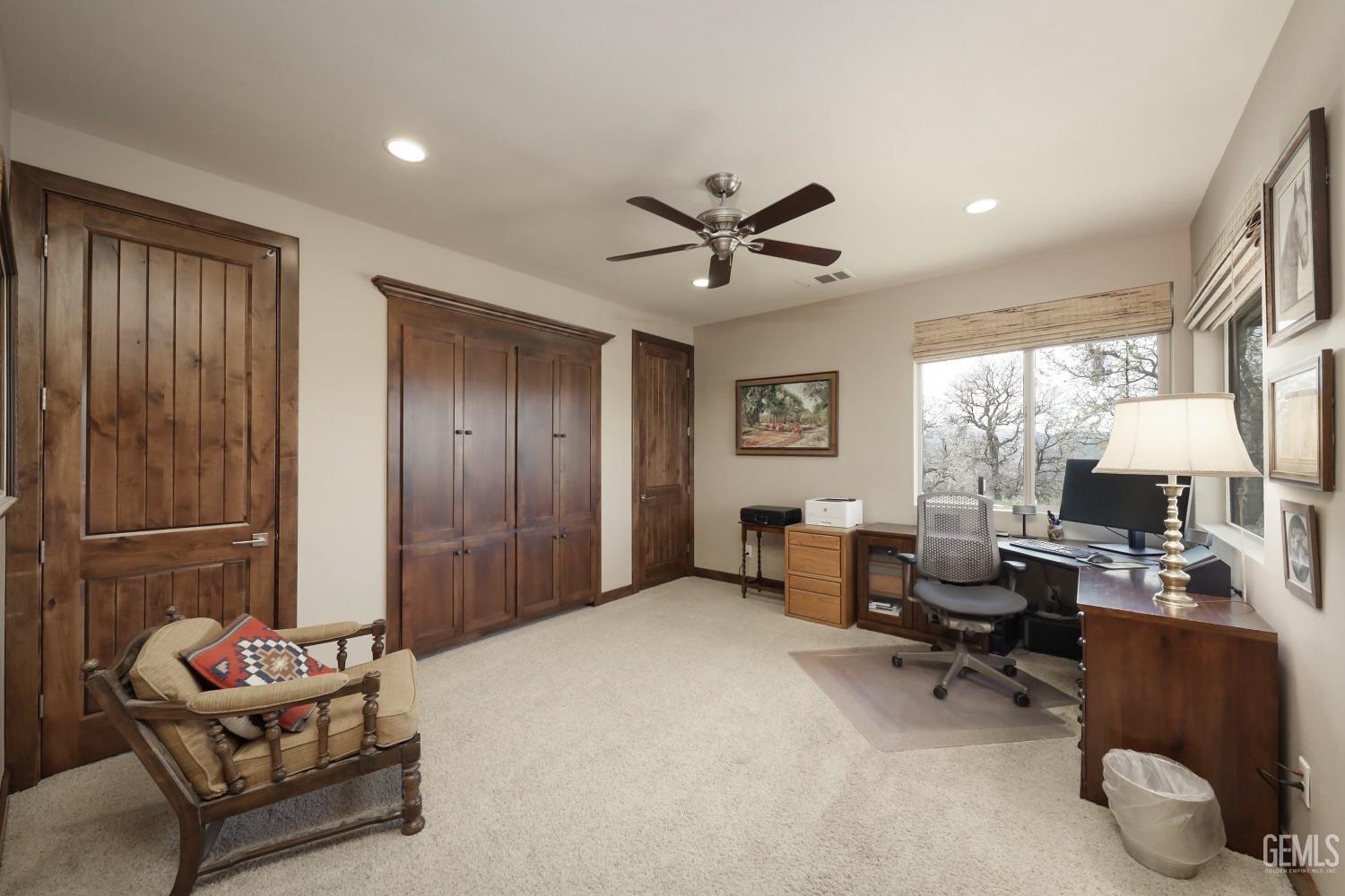 Undisclosed Address Bakersfield, CA 93308 - Photo 26 of 51 a living room with furniture and a large window