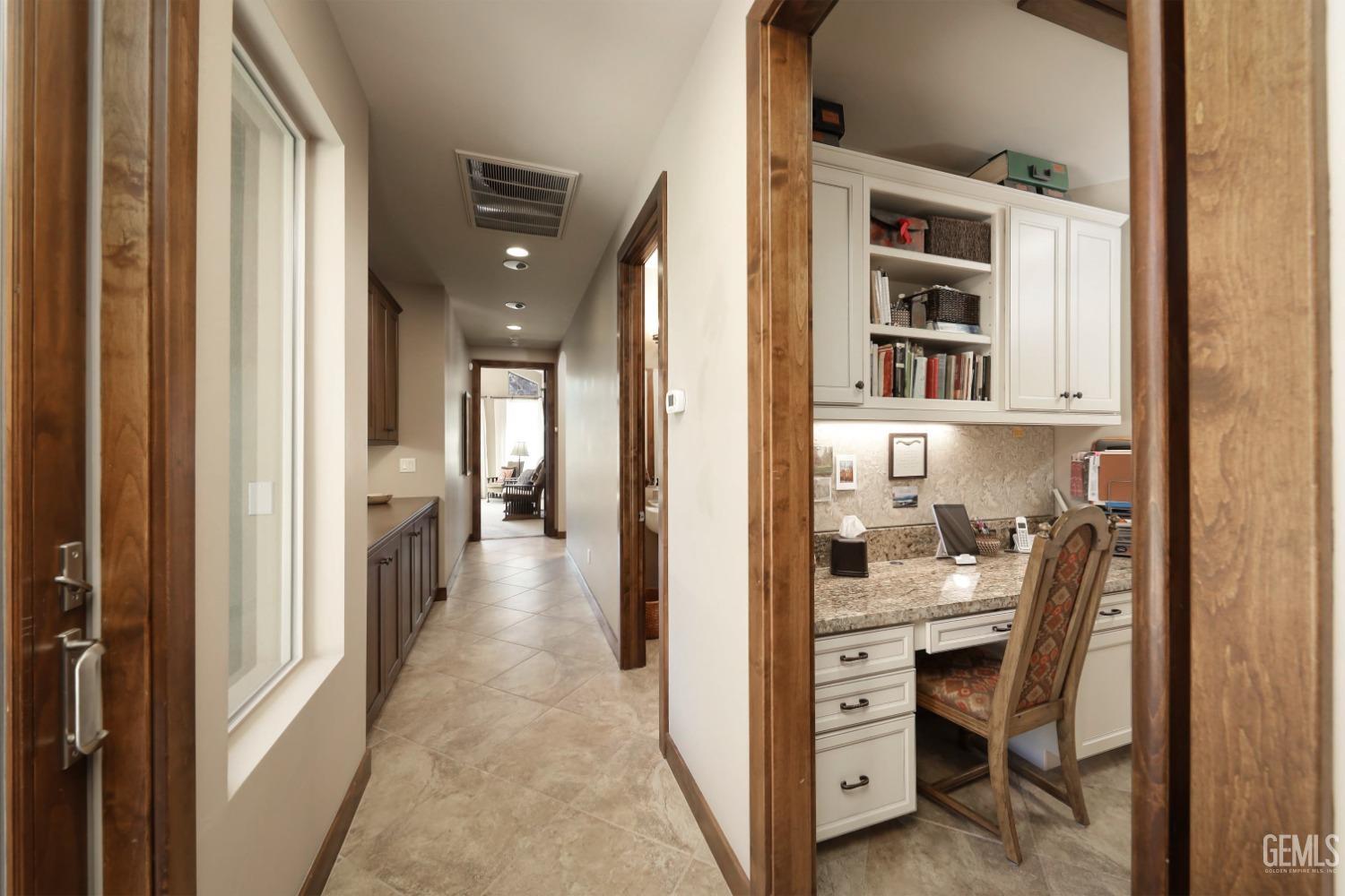 Undisclosed Address Bakersfield, CA 93308 - Photo 29 of 51 a view of a hallway with kitchen and entryway