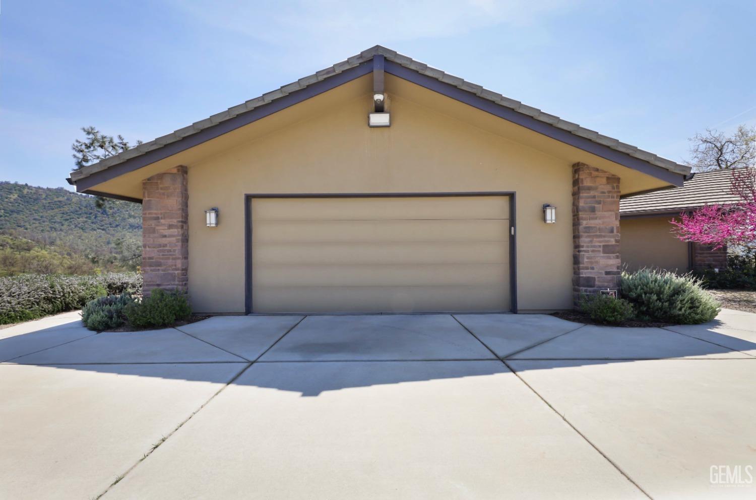 Undisclosed Address Bakersfield, CA 93308 - Photo 34 of 51 a front view of a house with garage