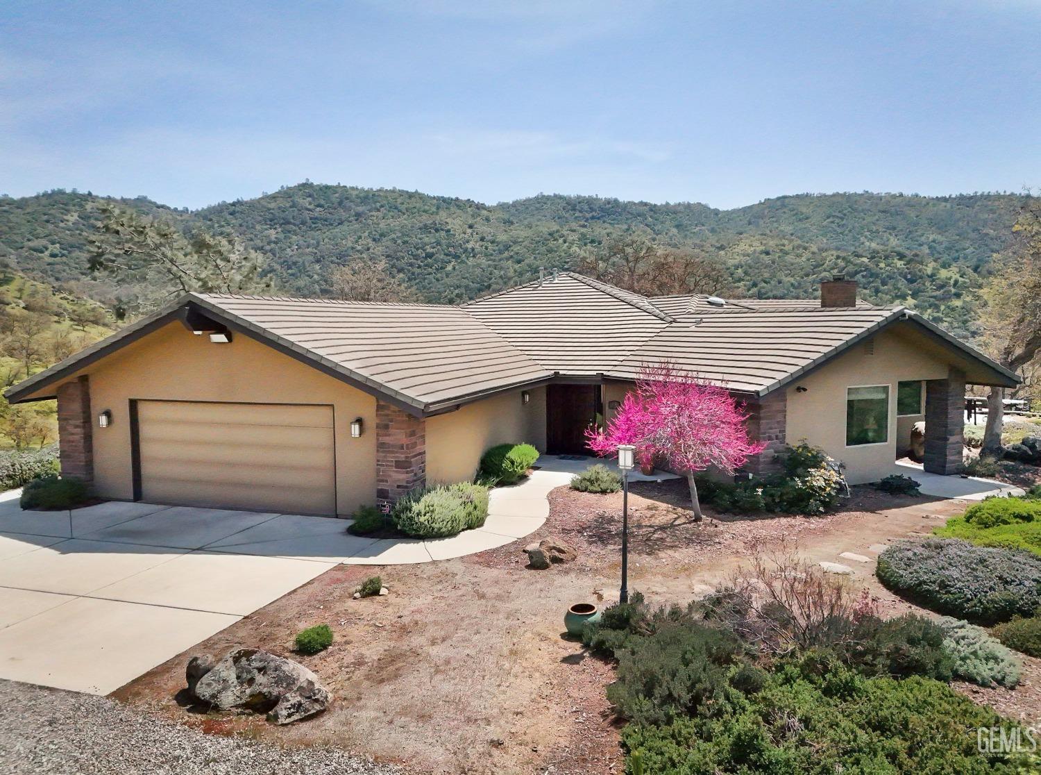 Undisclosed Address Bakersfield, CA 93308 - Photo 41 of 51 front view of a house with a yard