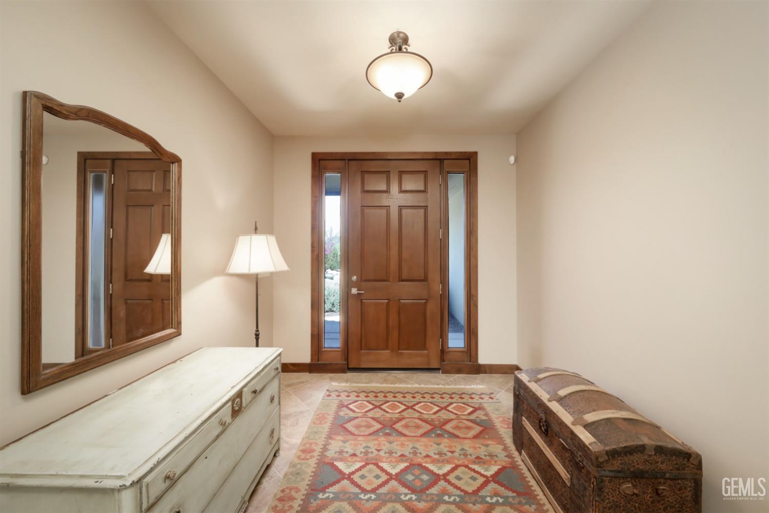 Undisclosed Address Bakersfield, CA 93308 - Photo 9 of 51 a bedroom with a bed and a lamp with window