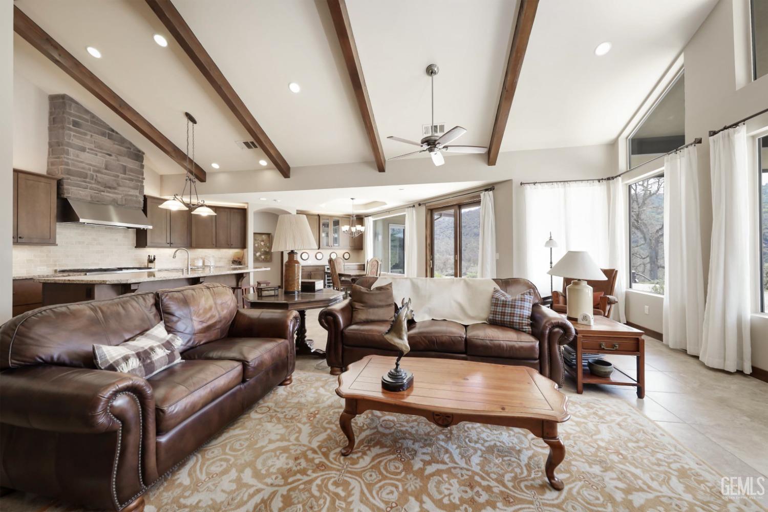 Undisclosed Address Bakersfield, CA 93308 - Photo 10 of 51 a living room with furniture and a large window