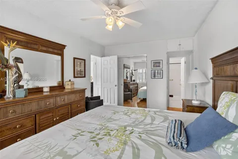 a bed room with a bed and a chandelier