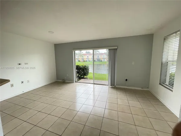 a view of an empty room with a window