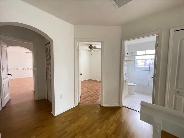 wooden floor with a bedroom