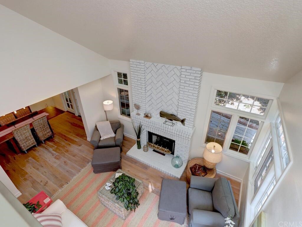 22 Chelsea Dana Point, CA 92629 - Photo 12 of 27 a living room with furniture and a fireplace