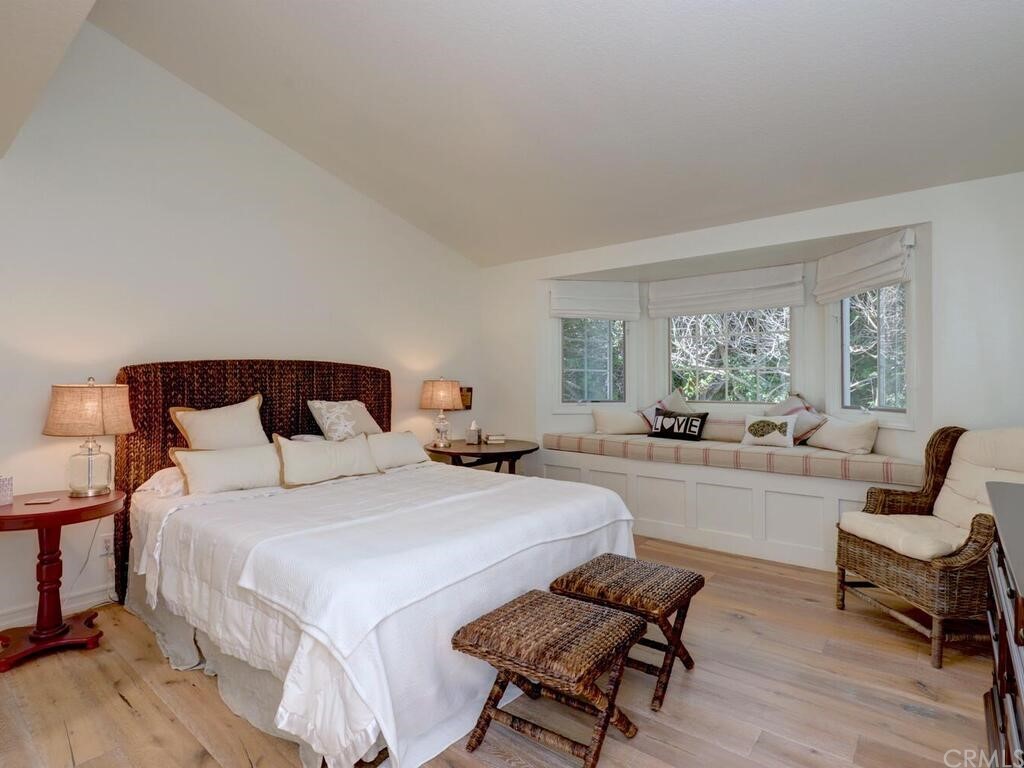 22 Chelsea Dana Point, CA 92629 - Photo 14 of 27 a bedroom with furniture and a large window
