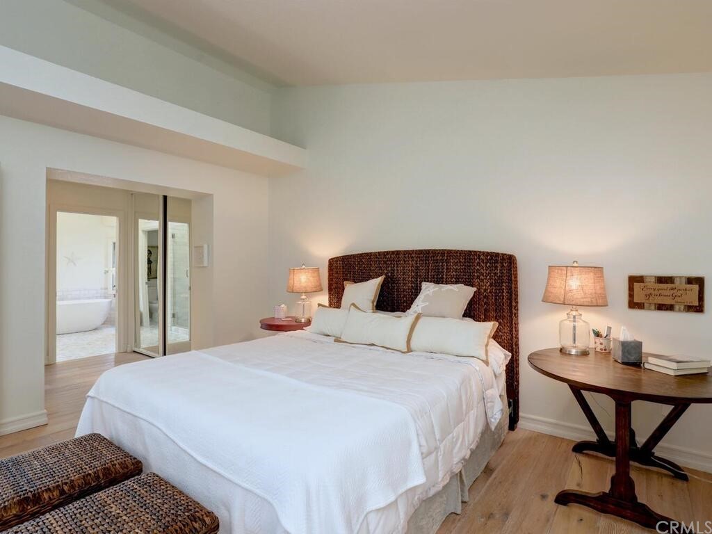 22 Chelsea Dana Point, CA 92629 - Photo 15 of 27 a bedroom with a bed and chair