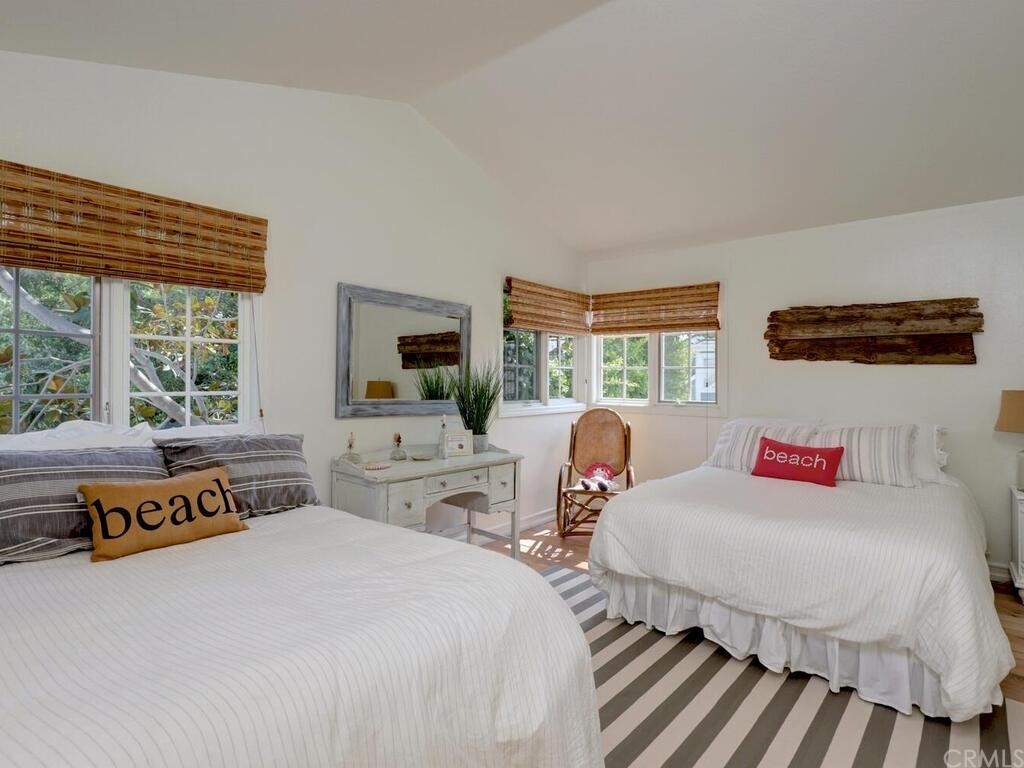 22 Chelsea Dana Point, CA 92629 - Photo 18 of 27 a bedroom with two beds and a large window