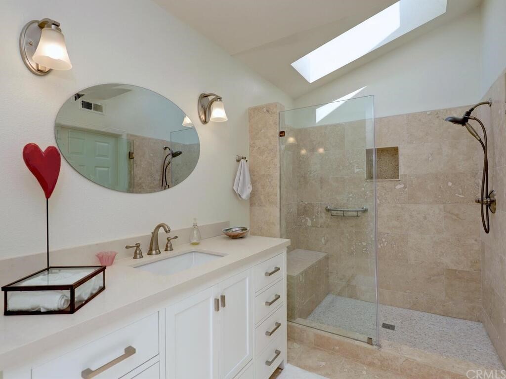 22 Chelsea Dana Point, CA 92629 - Photo 20 of 27 a bathroom with a sink double vanity and shower