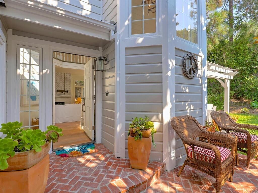 22 Chelsea Dana Point, CA 92629 - Photo 4 of 27 a view of a patio with table and chairs potted plants