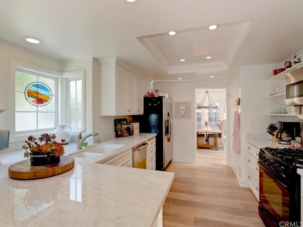 22 Chelsea Dana Point, CA 92629 - Photo 9 of 27 a living room with furniture and a flat screen tv