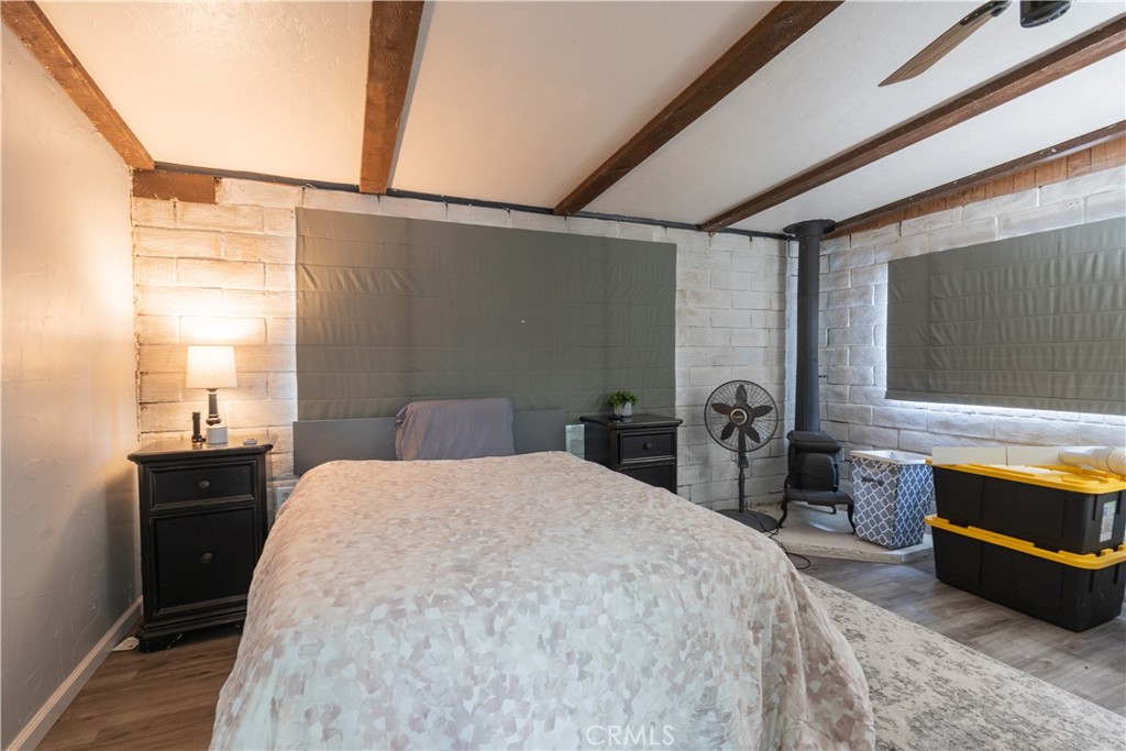 4500 Gage Irving Road Paso Robles, CA 93446 - Photo 8 of 16 a bedroom with a bed and a dresser next to a window