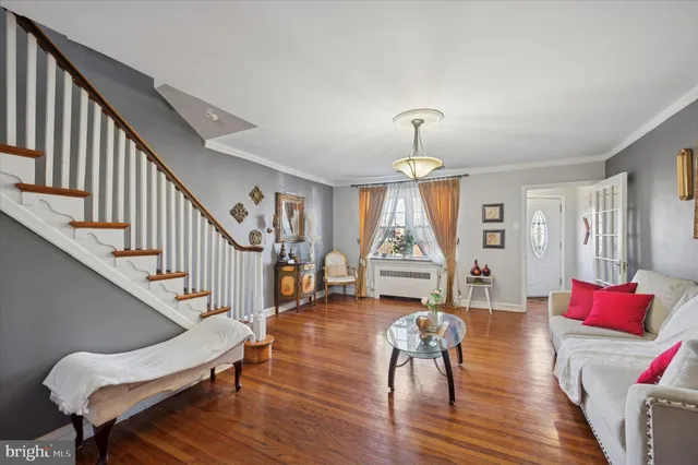 a view of entryway livingroom and hall with wooden floor