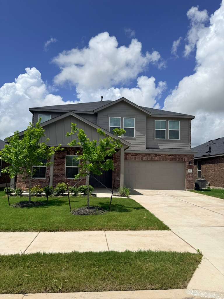 192 Rodney Boat Road Kyle, TX 78640 - Photo 1 of 40 A striking contemporary home with a neatly manicured lawn and an integrated garage.