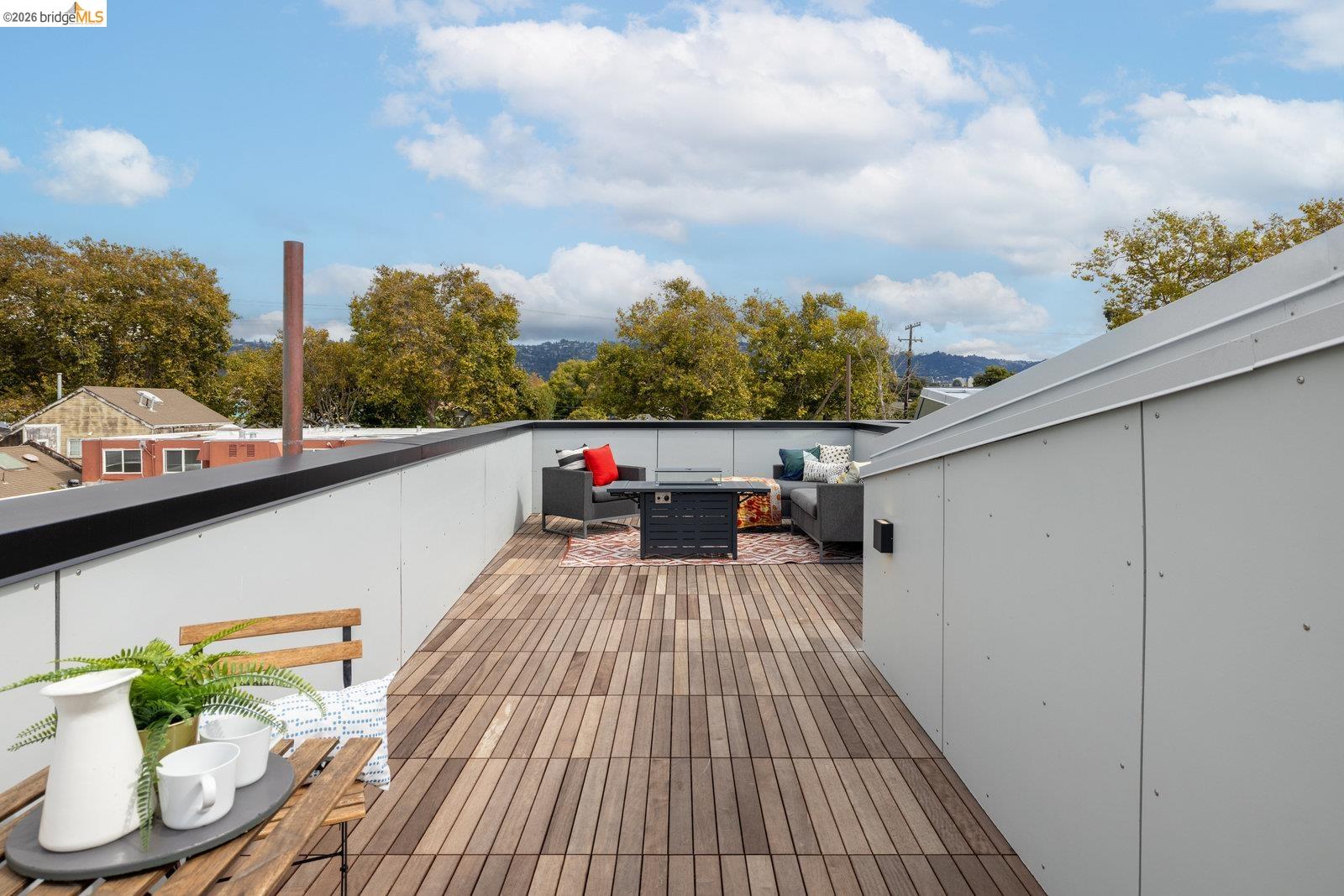 809 Jones Street Berkeley, CA 94710 - Photo 27 of 33 a view of a balcony with couches and wooden floor