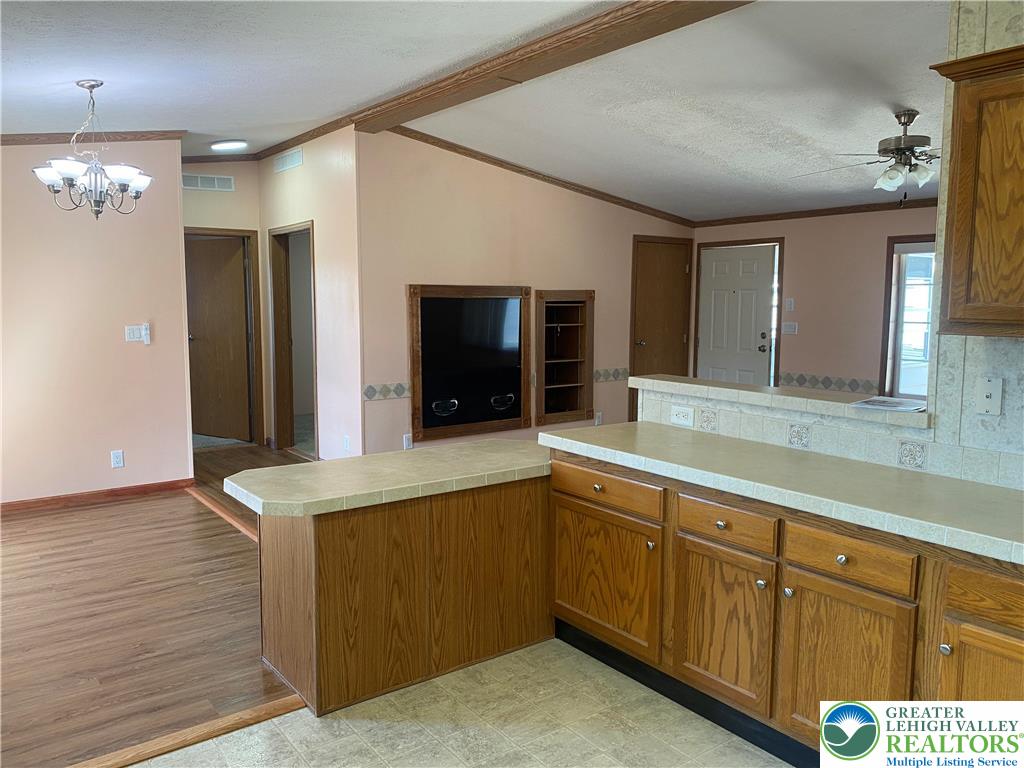 82 Pheasant Drive Kutztown, PA 19530 - Photo 14 of 32 a spacious bathroom with a granite countertop sink and a mirror