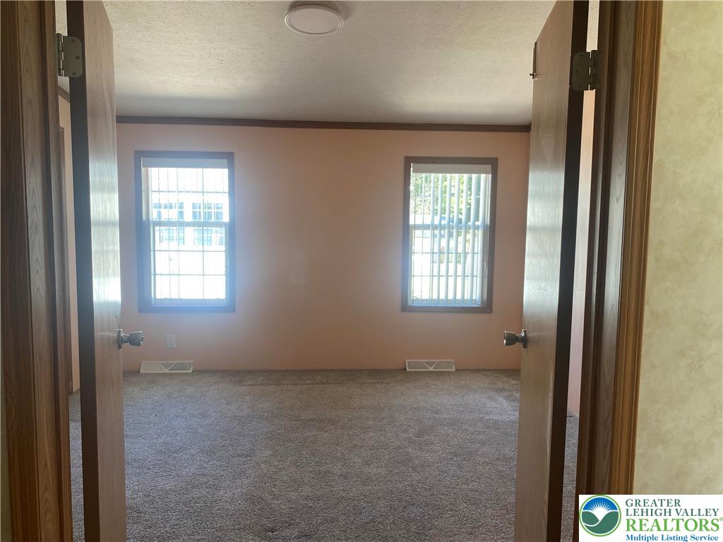 82 Pheasant Drive Kutztown, PA 19530 - Photo 19 of 32 a view of an empty room with a window