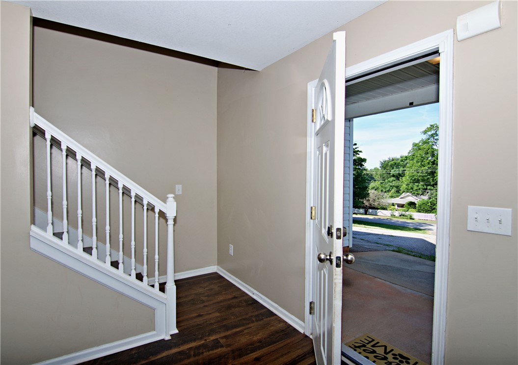 305 North Chestnut Street Seneca, SC 29678 - Photo 22 of 44 An inviting entry foyer with rich hardwood flooring welcomes guests into the home.