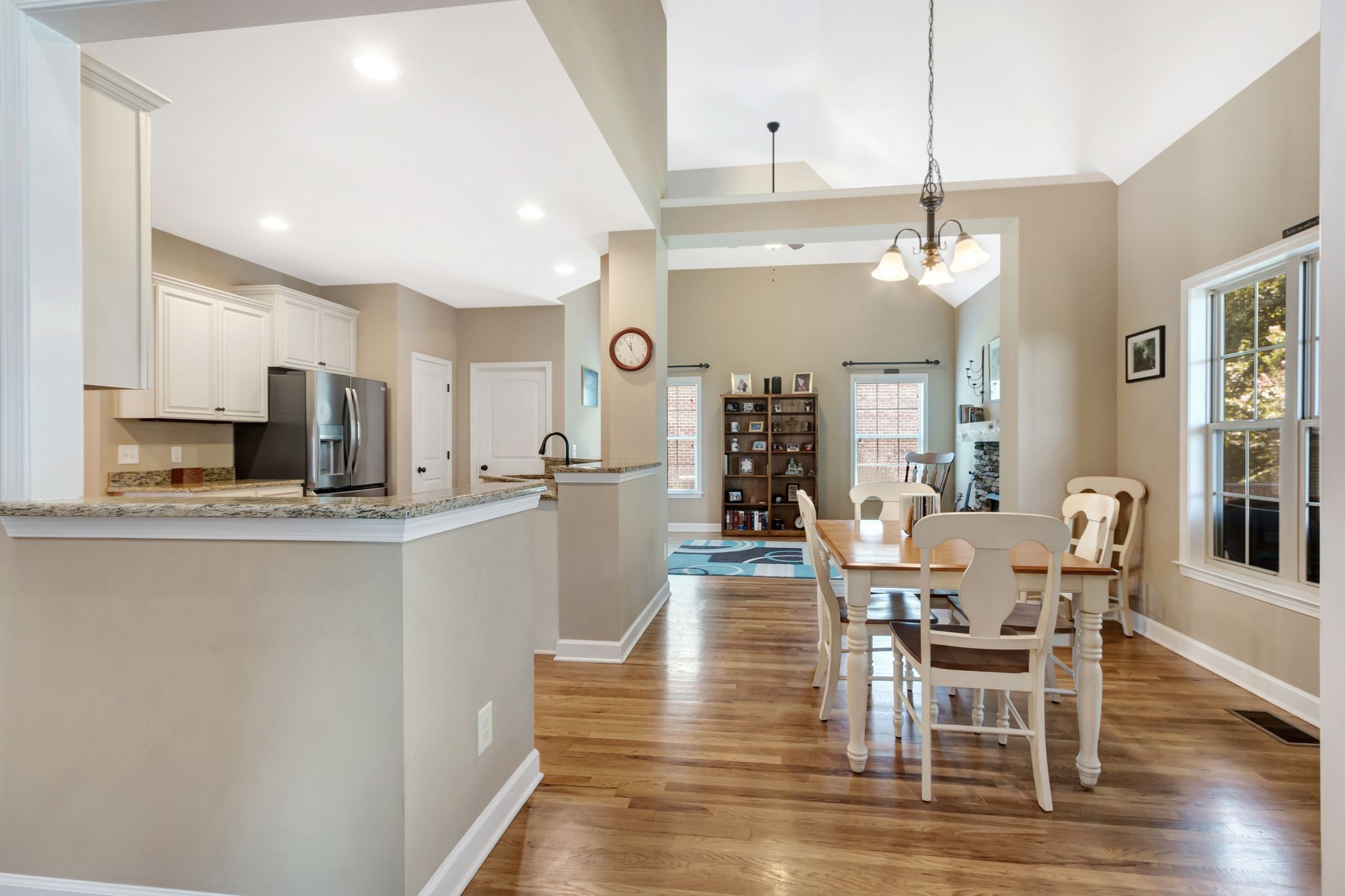 1004 Rudder Drive Spring Hill, TN 37174 - Photo 11 of 50 a view of a dining room and livingroom with furniture wooden floor a chandelier