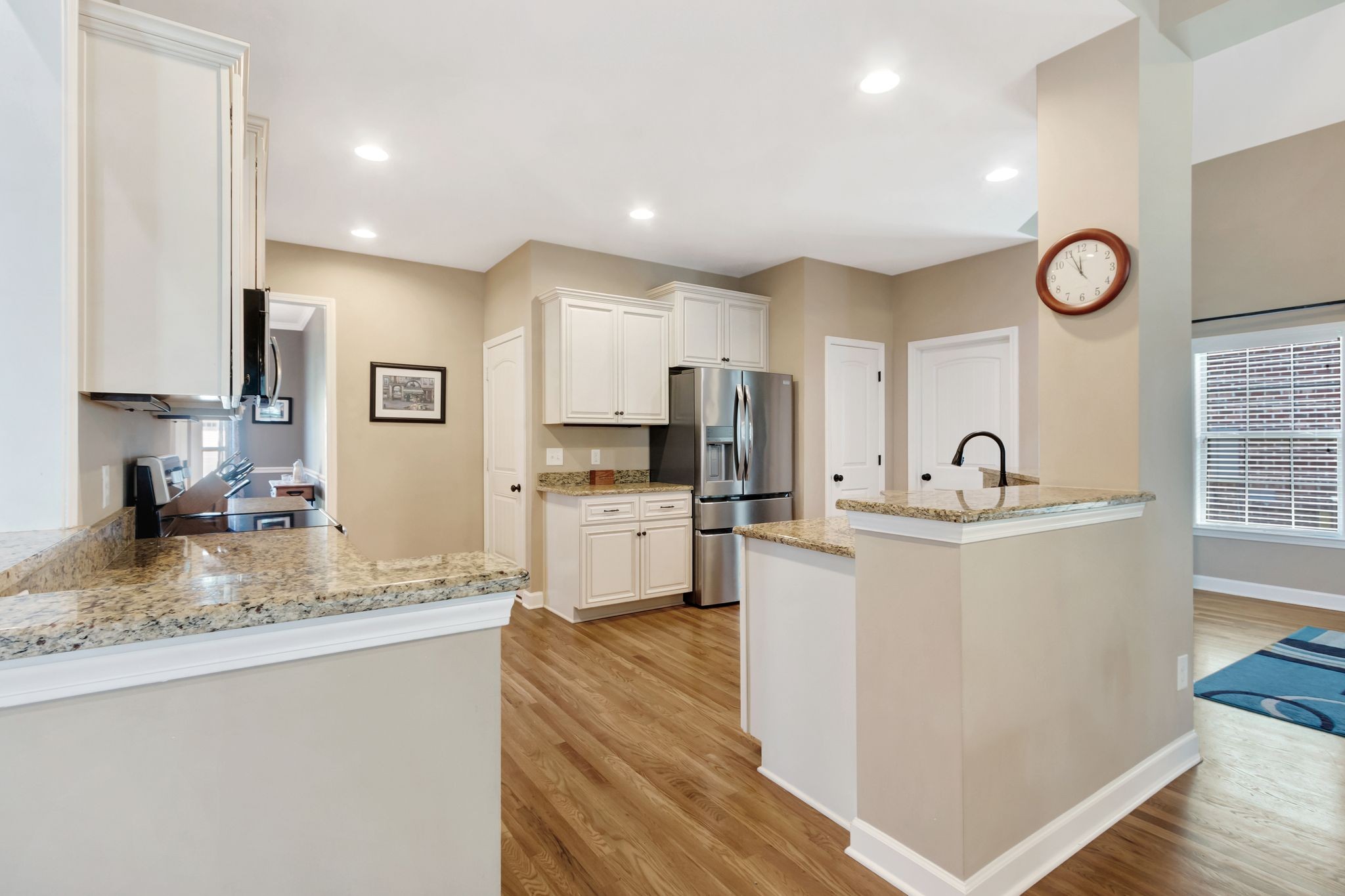 1004 Rudder Drive Spring Hill, TN 37174 - Photo 14 of 50 a kitchen with sink refrigerator and microwave