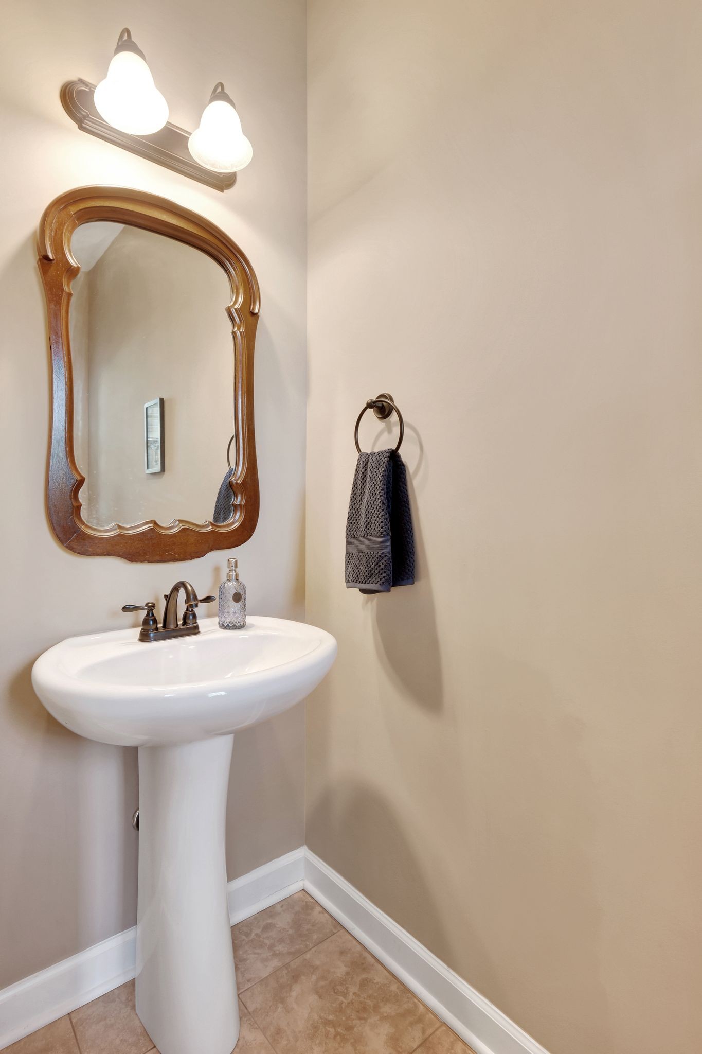 1004 Rudder Drive Spring Hill, TN 37174 - Photo 31 of 50 a bathroom with a sink and mirror