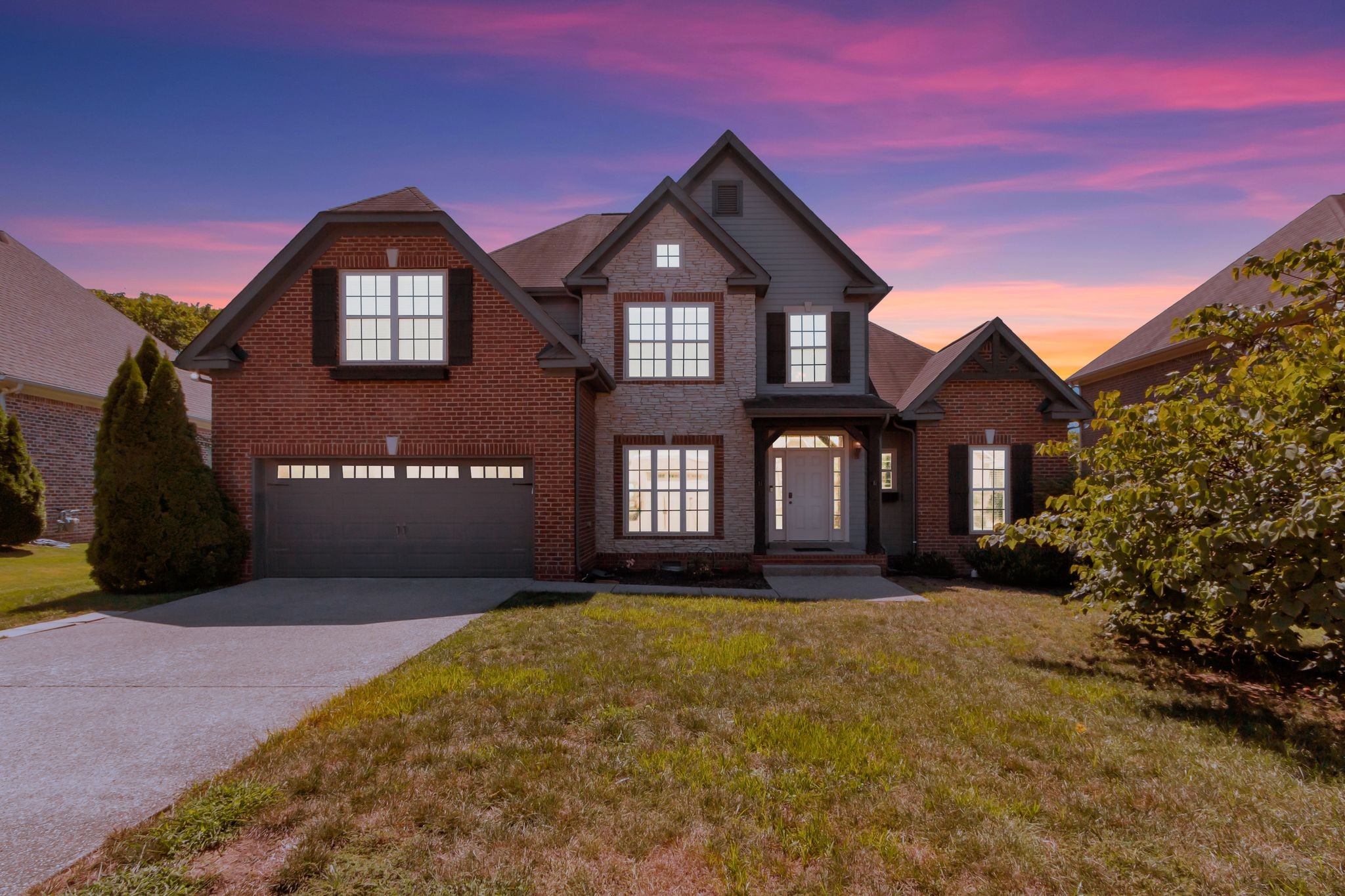 1004 Rudder Drive Spring Hill, TN 37174 - Photo 45 of 50 a front view of a house with a yard and garage