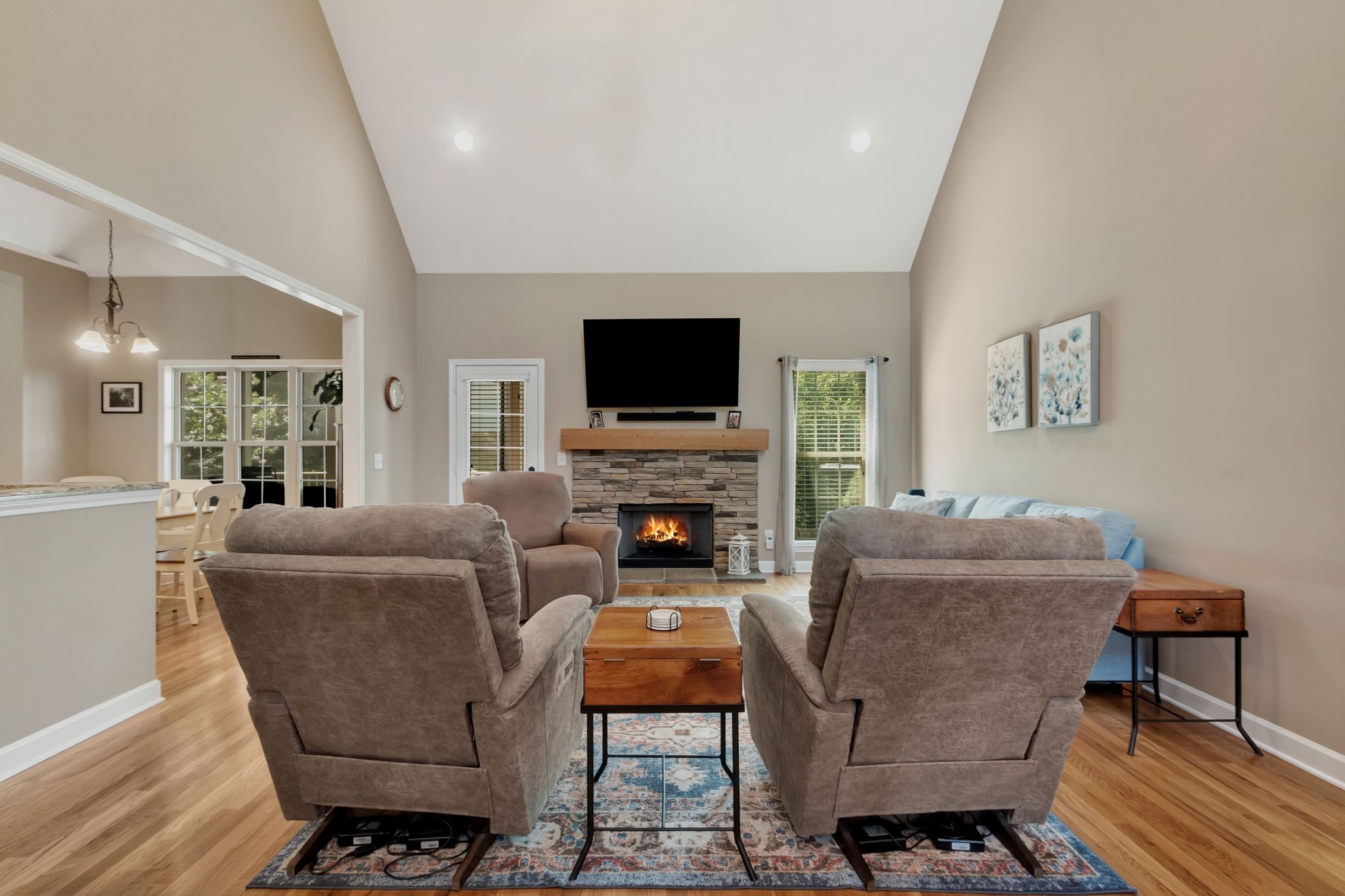 1004 Rudder Drive Spring Hill, TN 37174 - Photo 8 of 50 a living room with furniture a flat screen tv and a fireplace