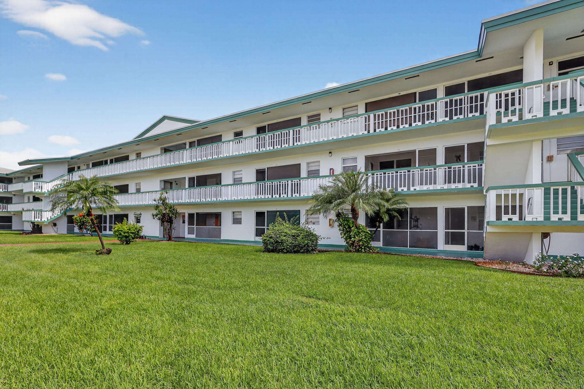a front view of building with yard