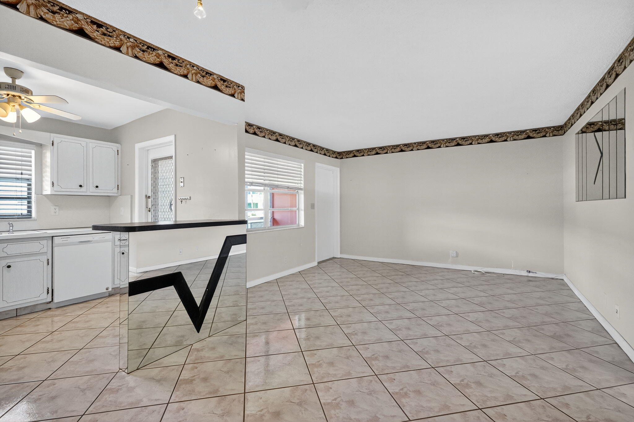 5300 Washington Street, Unit J116 Hollywood, FL 33021 - Photo 17 of 36 a view of a kitchen with a sink and cabinets