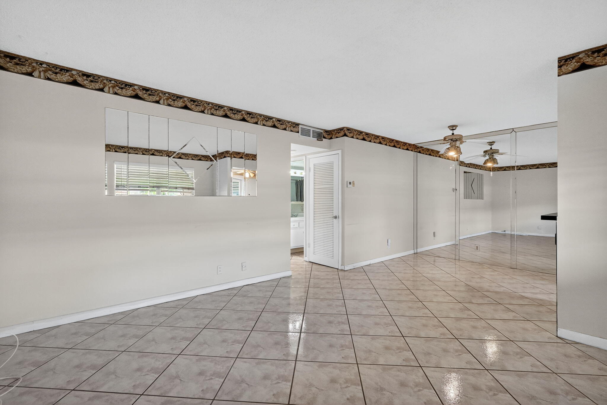 5300 Washington Street, Unit J116 Hollywood, FL 33021 - Photo 20 of 36 a view of a big room with wooden floor and windows