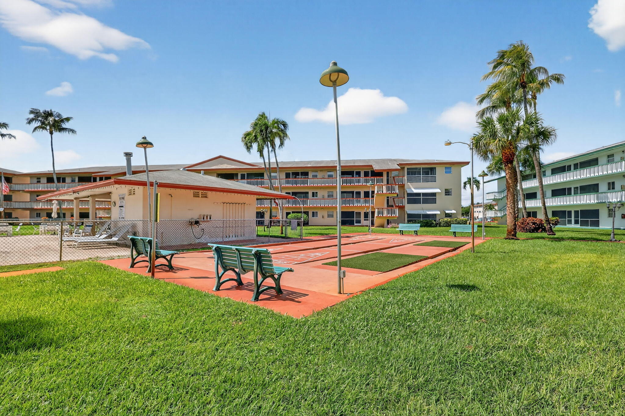 5300 Washington Street, Unit J116 Hollywood, FL 33021 - Photo 34 of 36 a view of a house with a backyard porch and sitting area