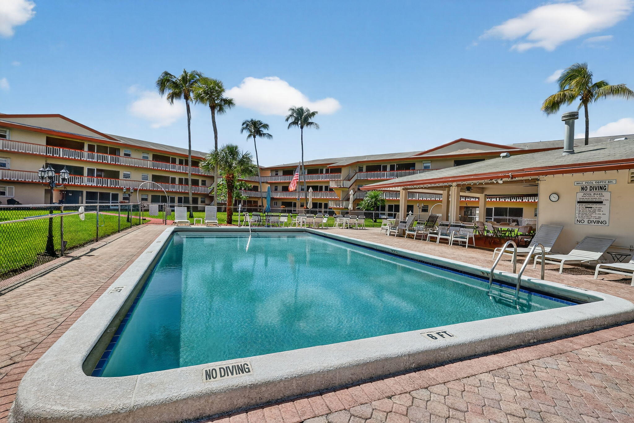5300 Washington Street, Unit J116 Hollywood, FL 33021 - Photo 35 of 36 a swimming pool view with a garden and plants