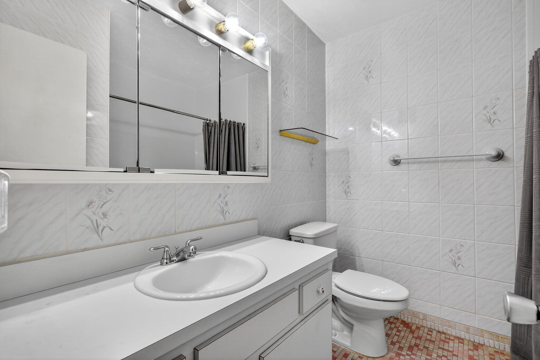 5300 Washington Street, Unit J116 Hollywood, FL 33021 - Photo 5 of 36 a bathroom with a sink a toilet and shower