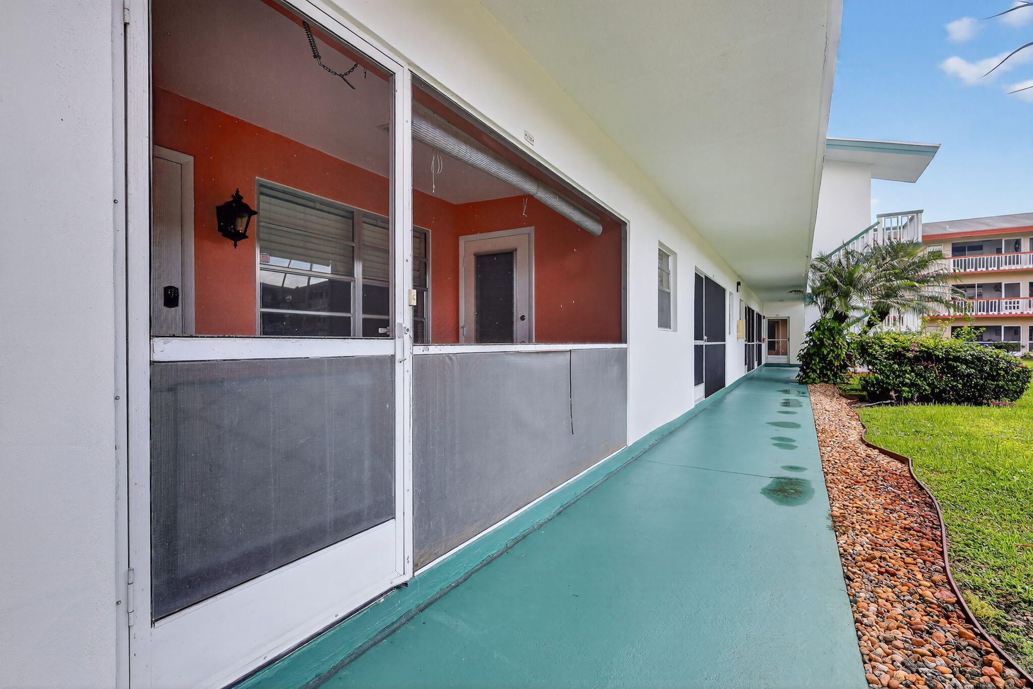 5300 Washington Street, Unit J116 Hollywood, FL 33021 - Photo 9 of 36 a view of a house with a yard