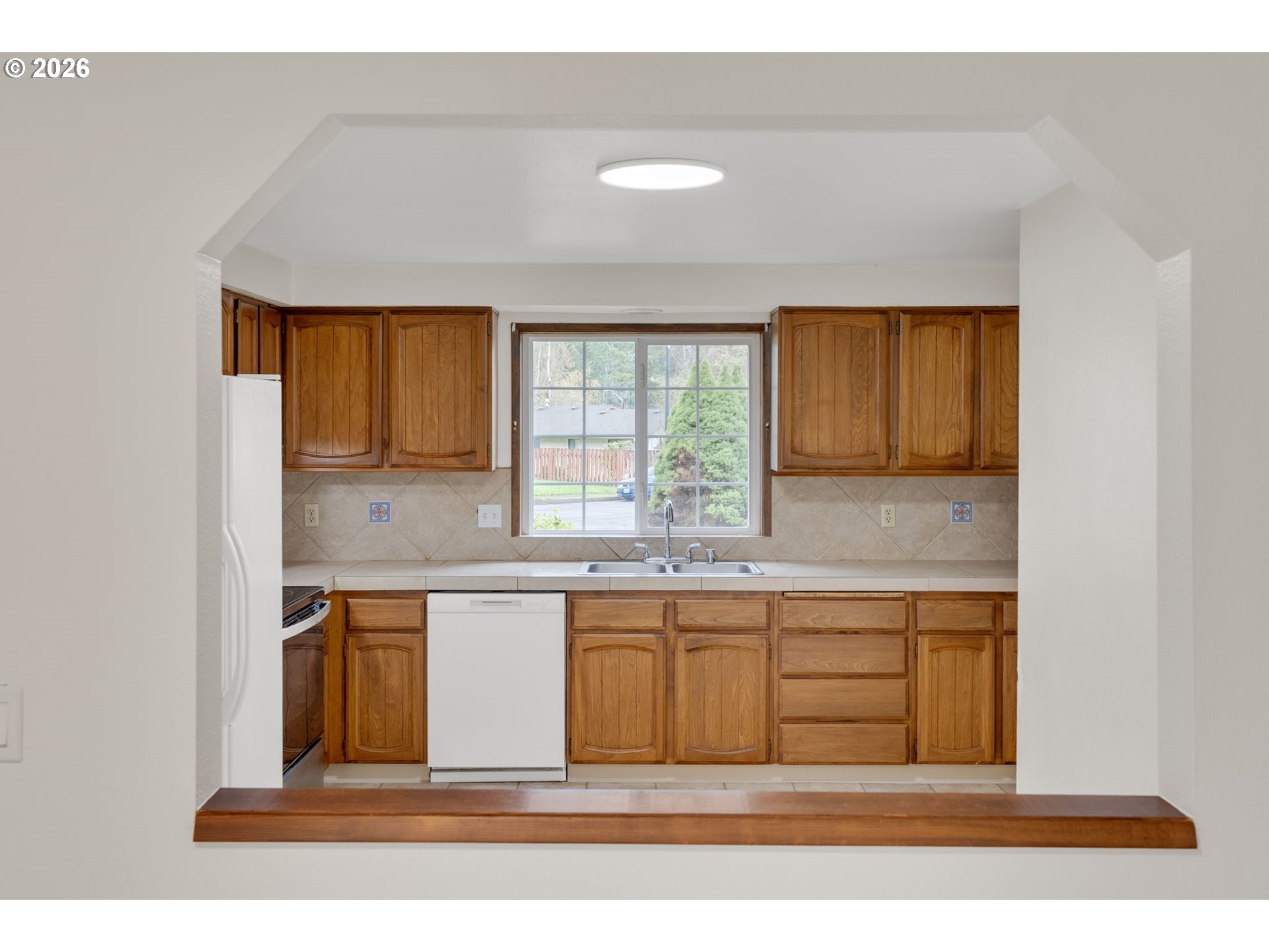 211 Southwest Royal Court Gresham, OR 97030 - Photo 14 of 37 a view of kitchen with wooden floor