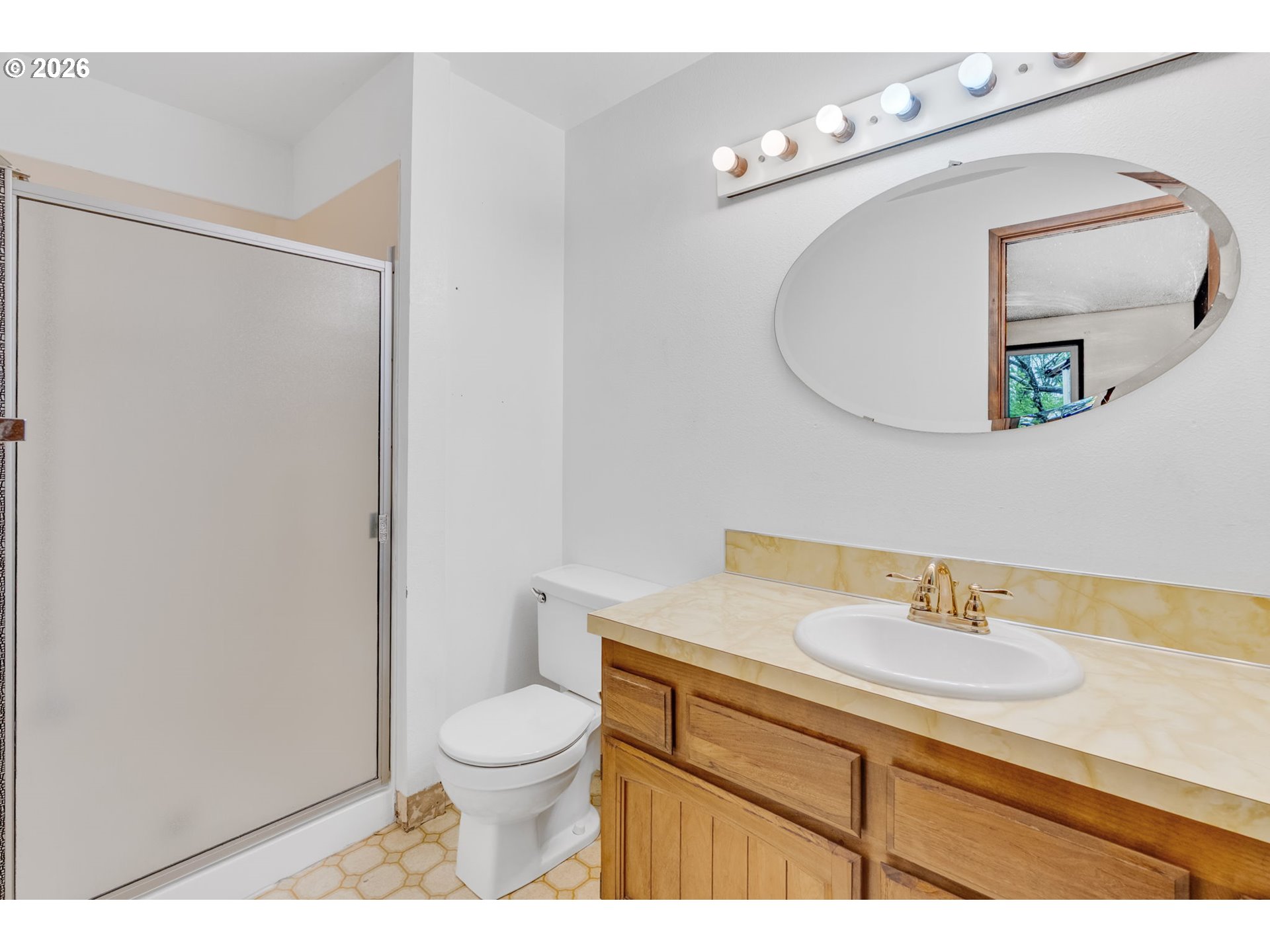 211 Southwest Royal Court Gresham, OR 97030 - Photo 22 of 37 a bathroom with a toilet a sink and mirror