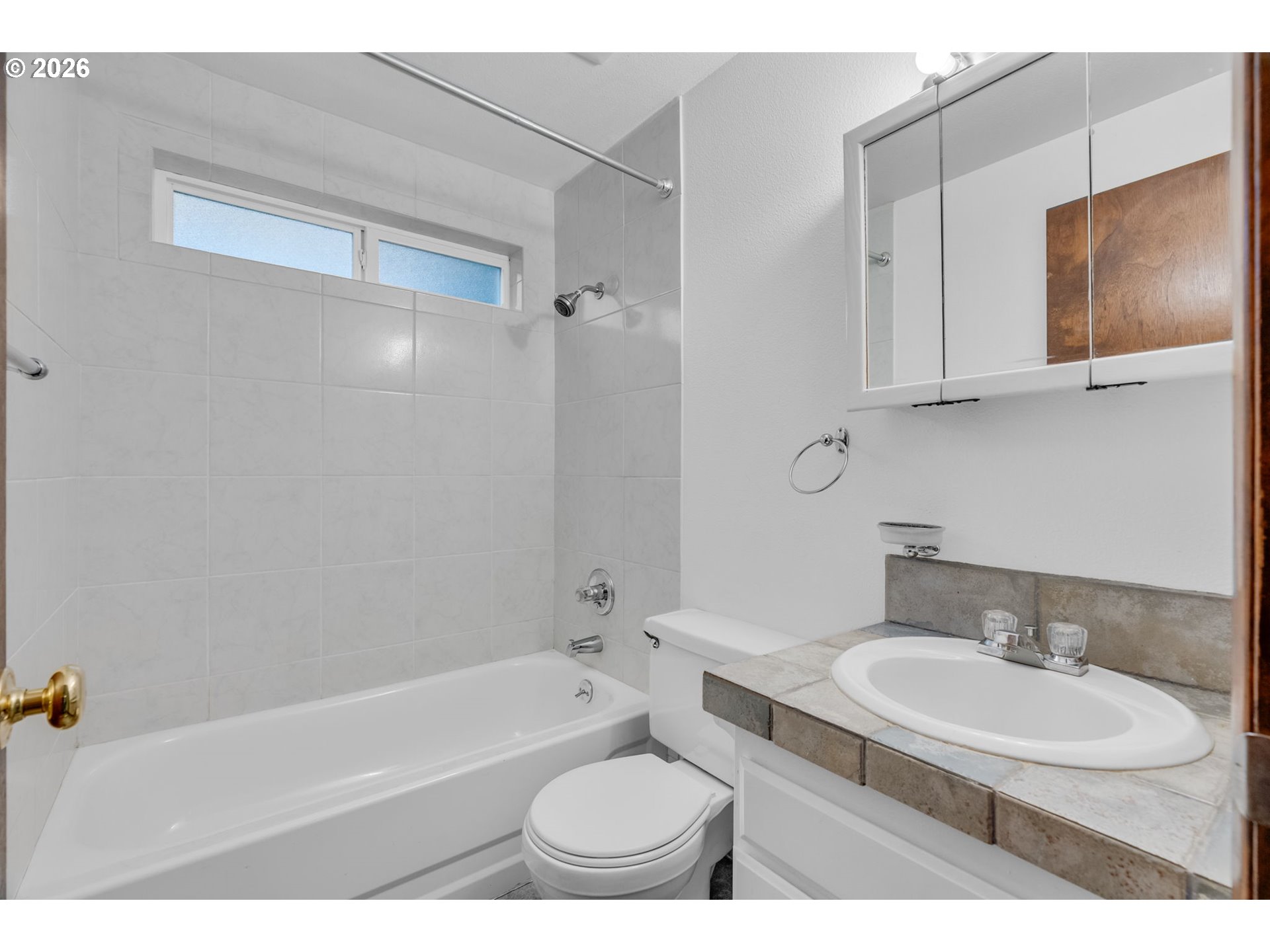 211 Southwest Royal Court Gresham, OR 97030 - Photo 27 of 37 a bathroom with a sink toilet a mirror and bathtub