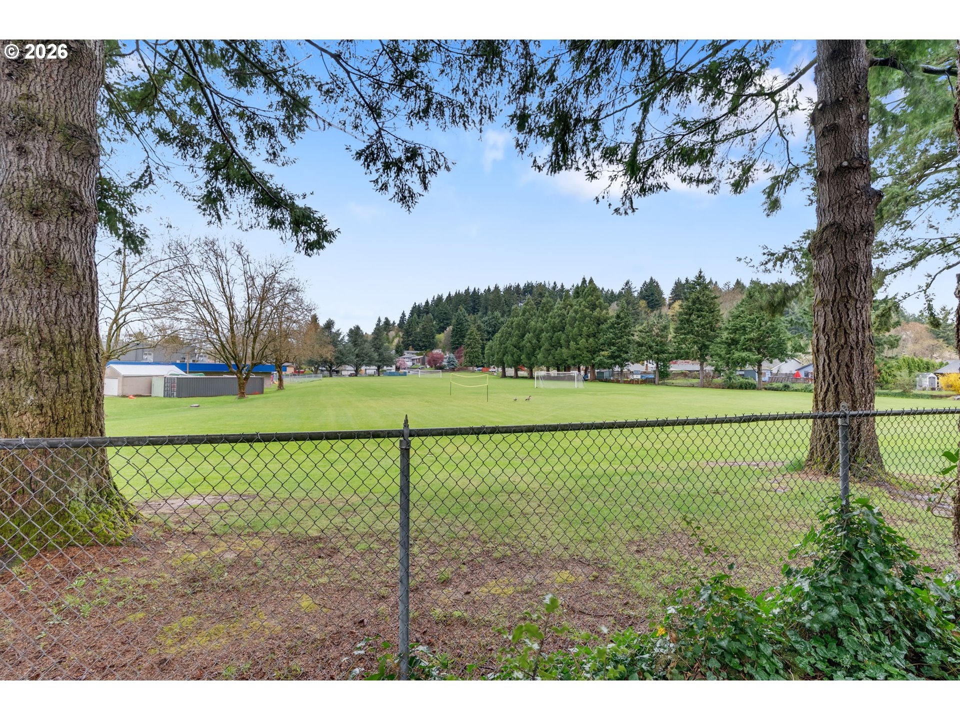 211 Southwest Royal Court Gresham, OR 97030 - Photo 37 of 37 a view of a field with a tree in the background