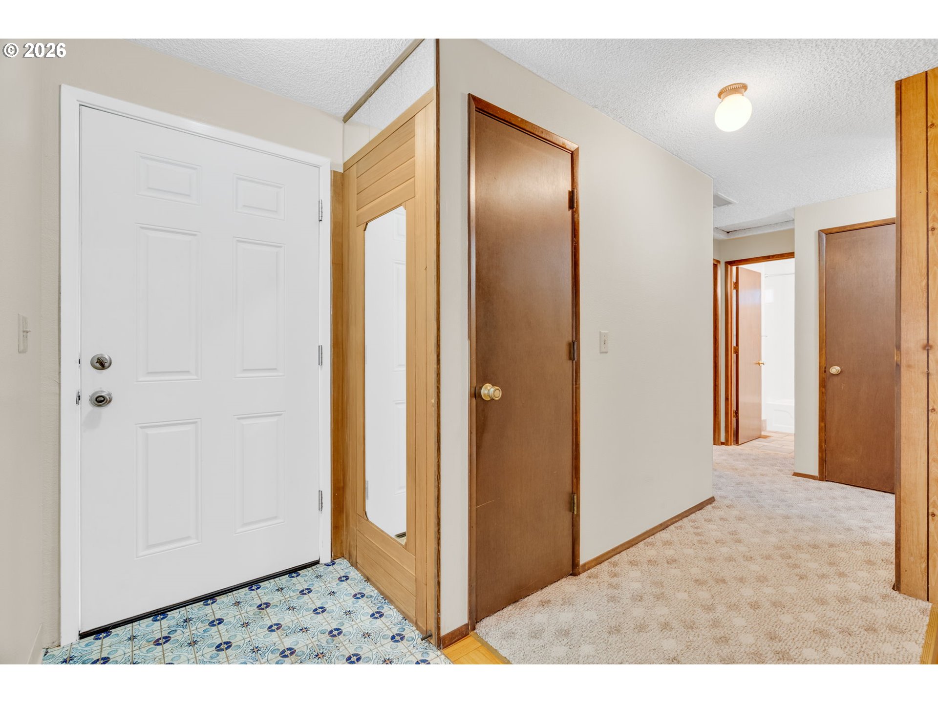 211 Southwest Royal Court Gresham, OR 97030 - Photo 4 of 37 a view of a hallway with wooden floor