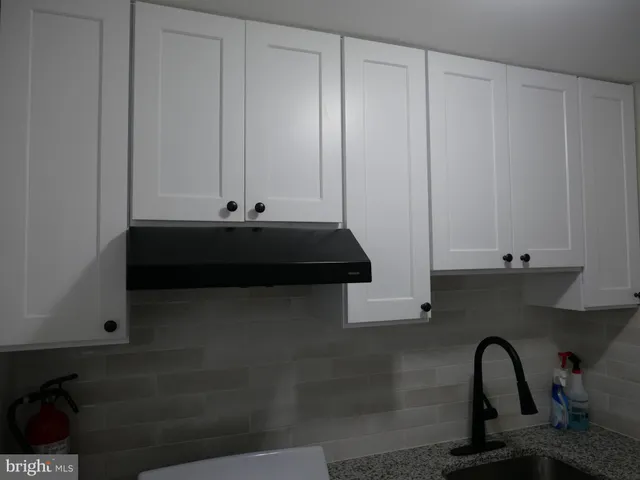 a view of cabinets and window