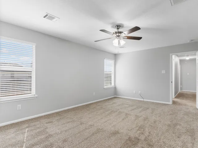 a view of an empty room with a window