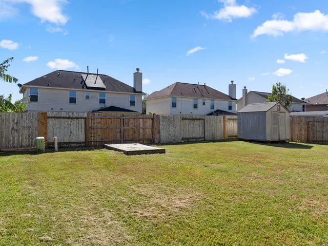 a swimming pool view with a outdoor seating