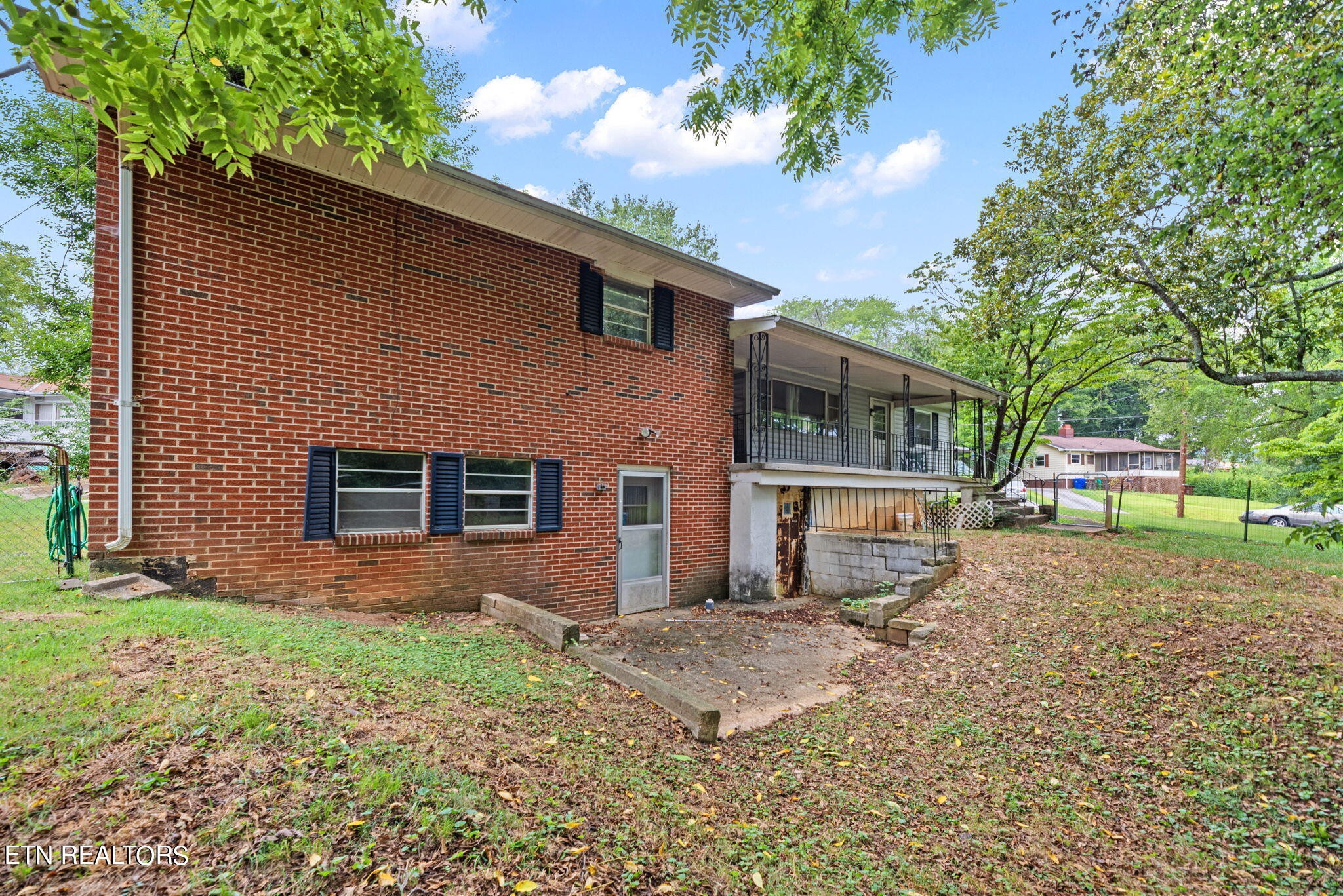 109 Venus Road Oak Ridge, TN 37830 - Photo 3 of 32 a front view of a house with a yard and garage
