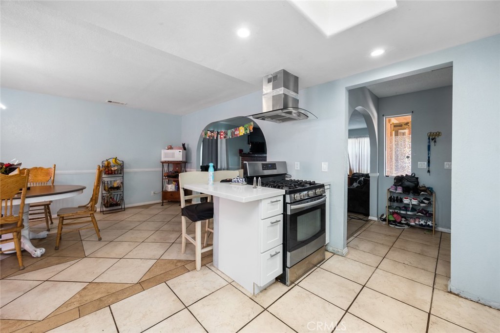 18629 Orange Street Hesperia, CA 92345 - Photo 15 of 46 a kitchen with a sink cabinets and appliances