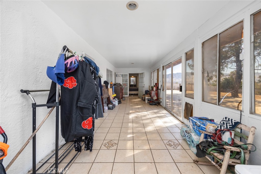 18629 Orange Street Hesperia, CA 92345 - Photo 23 of 46 a living room with furniture and a fireplace