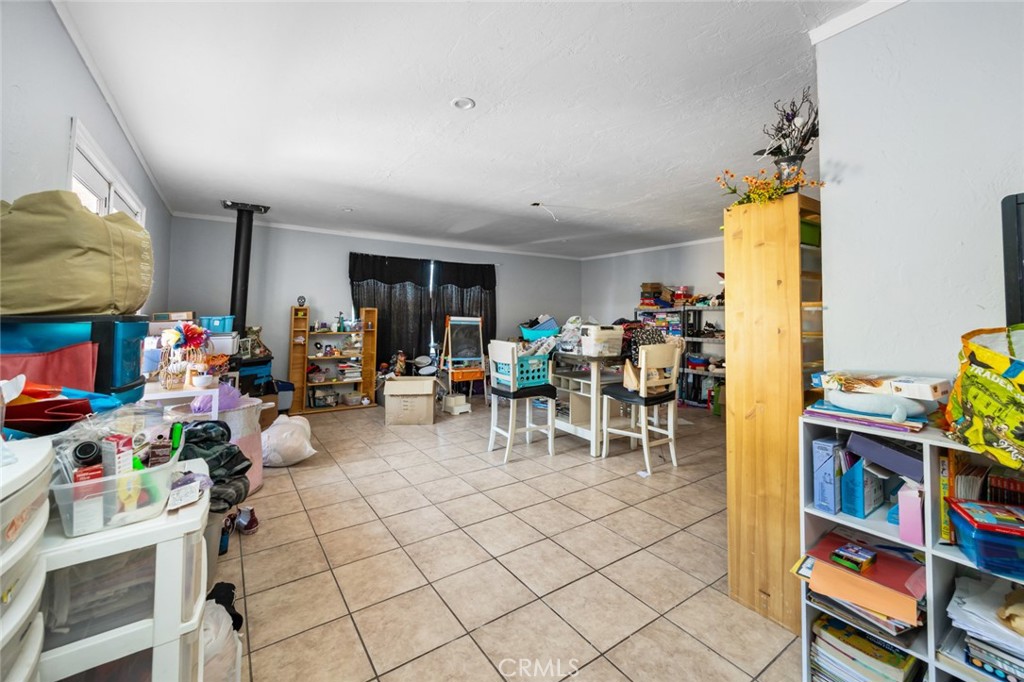 18629 Orange Street Hesperia, CA 92345 - Photo 29 of 46 a view of a play room with furniture and toys