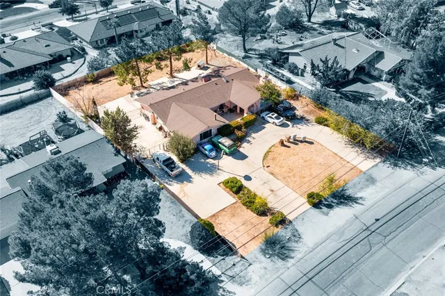 an aerial view of residential house with outdoor space and swimming pool