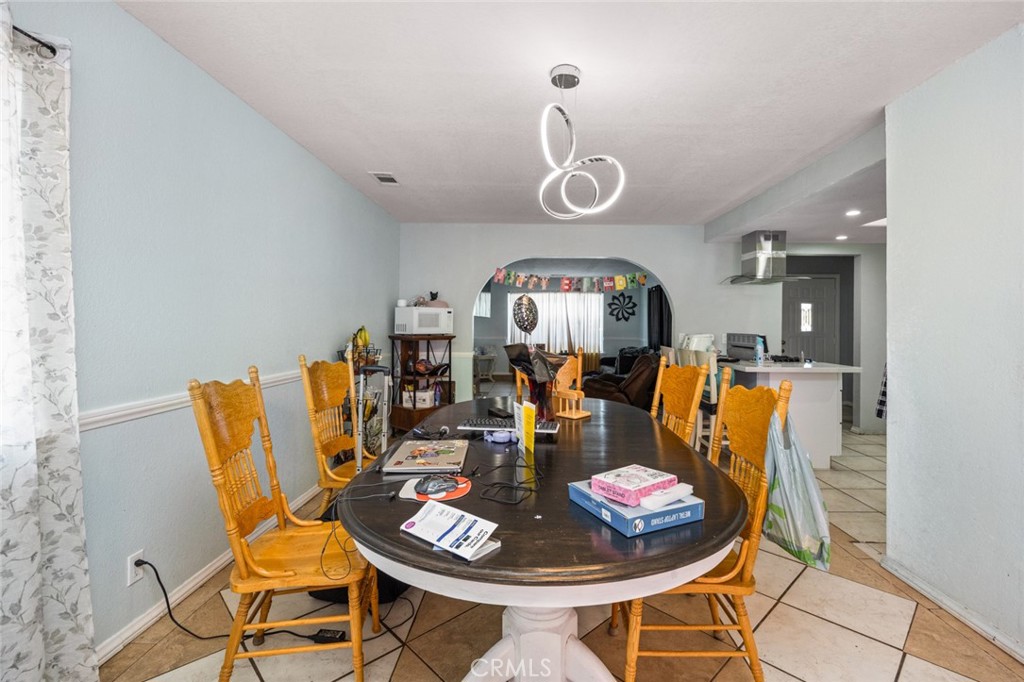 18629 Orange Street Hesperia, CA 92345 - Photo 10 of 46 a living room with dining table and chairs